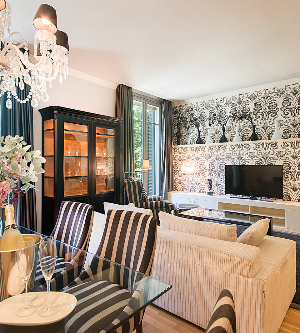 Casa Verd&uacute; designer living room with striped seating and a patterned feature wall
