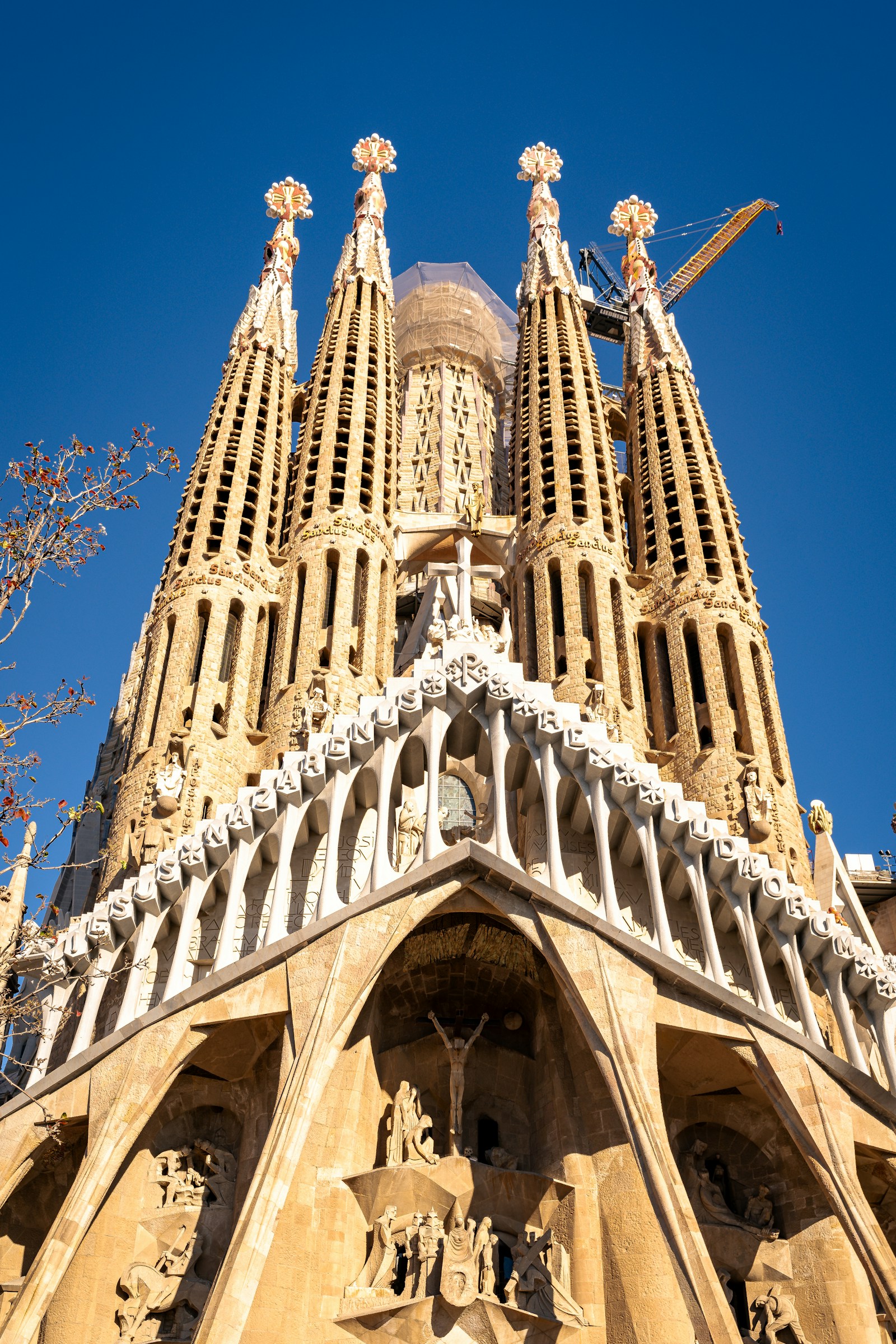 The Sagrada Família basilica and its towers beneath a clear blue sky