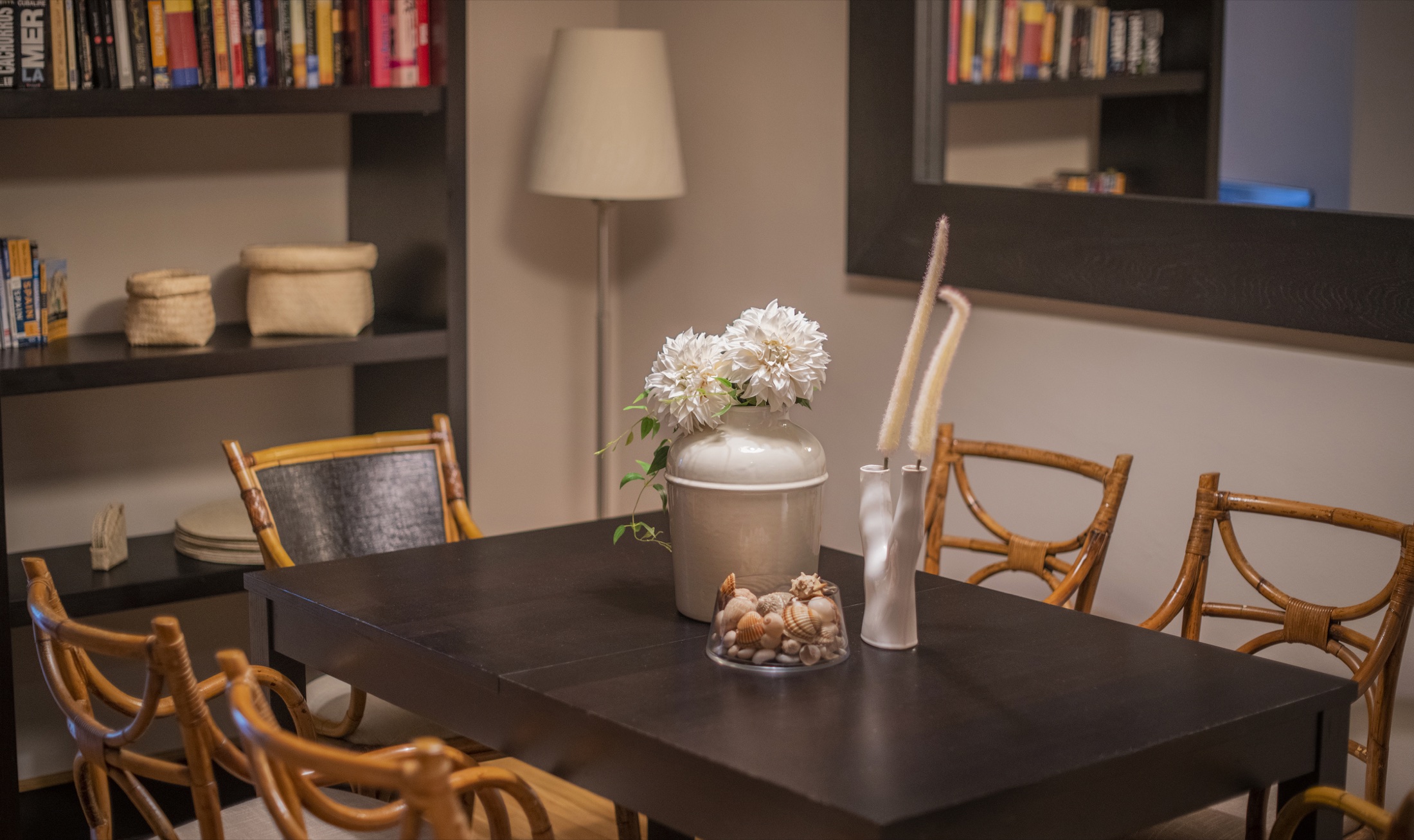 Built-in bookshelves above the Suite Bella dining table