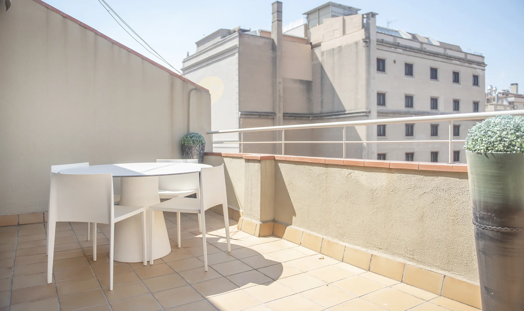 Suite Divina terrace table beside the balcony wall
