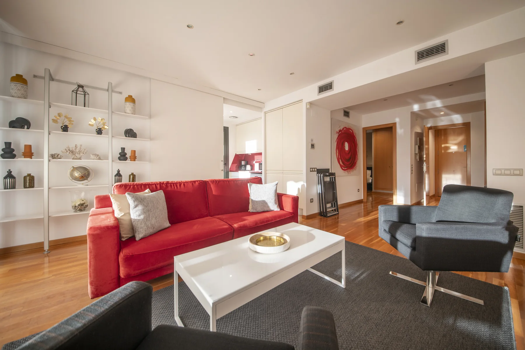 Suite Divina red sofa and display shelving