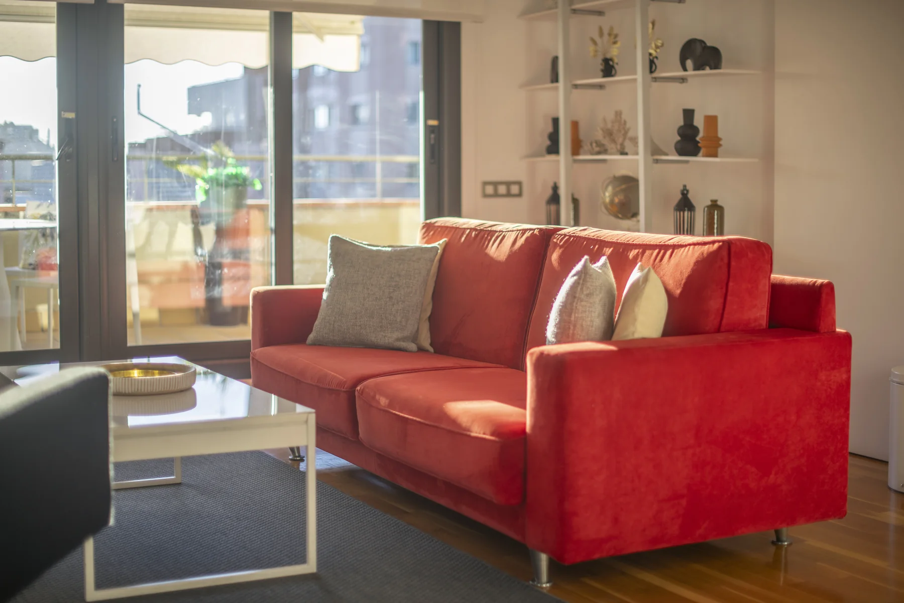 Suite Divina red sofa and display shelves