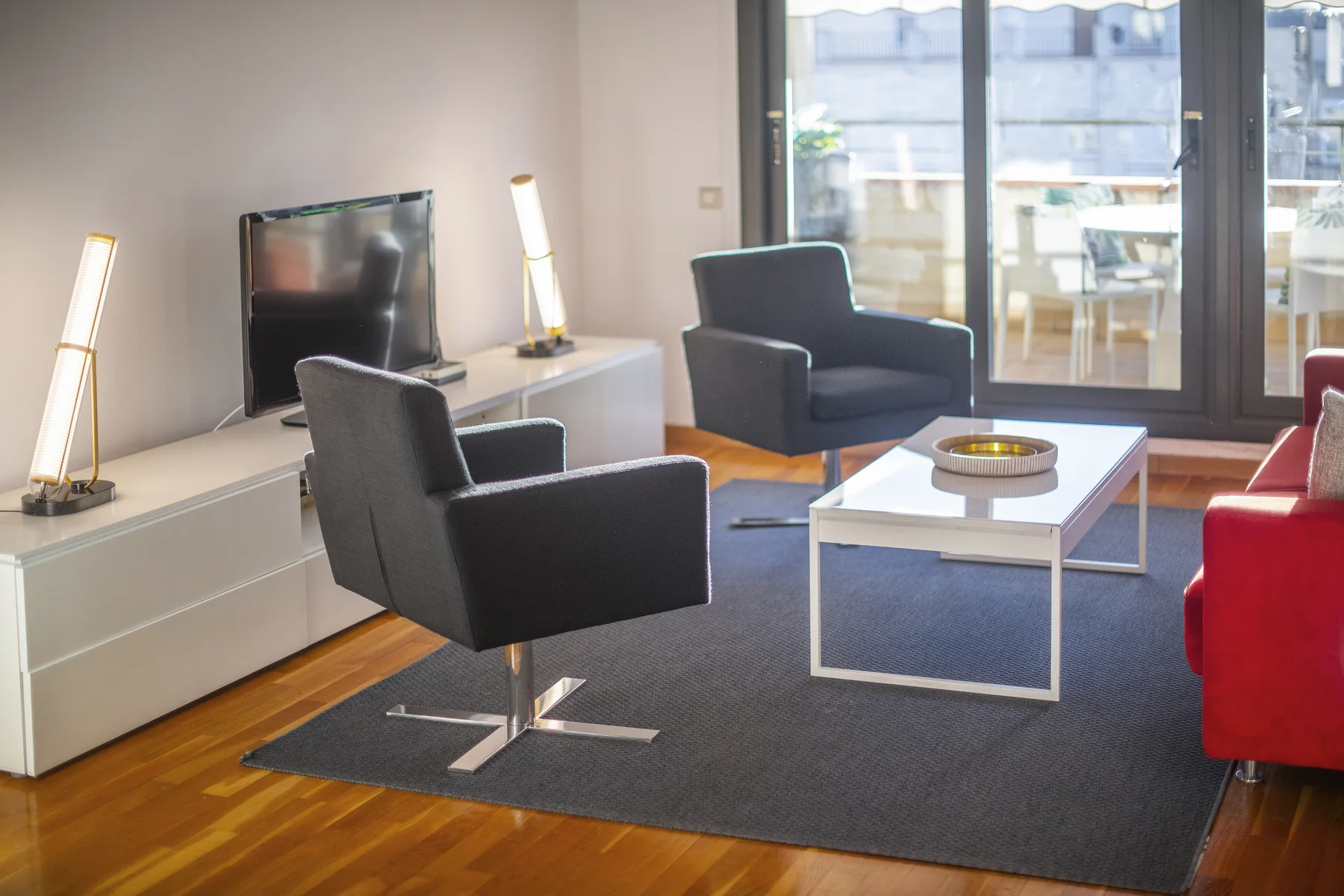 Suite Divina armchairs framing the terrace view