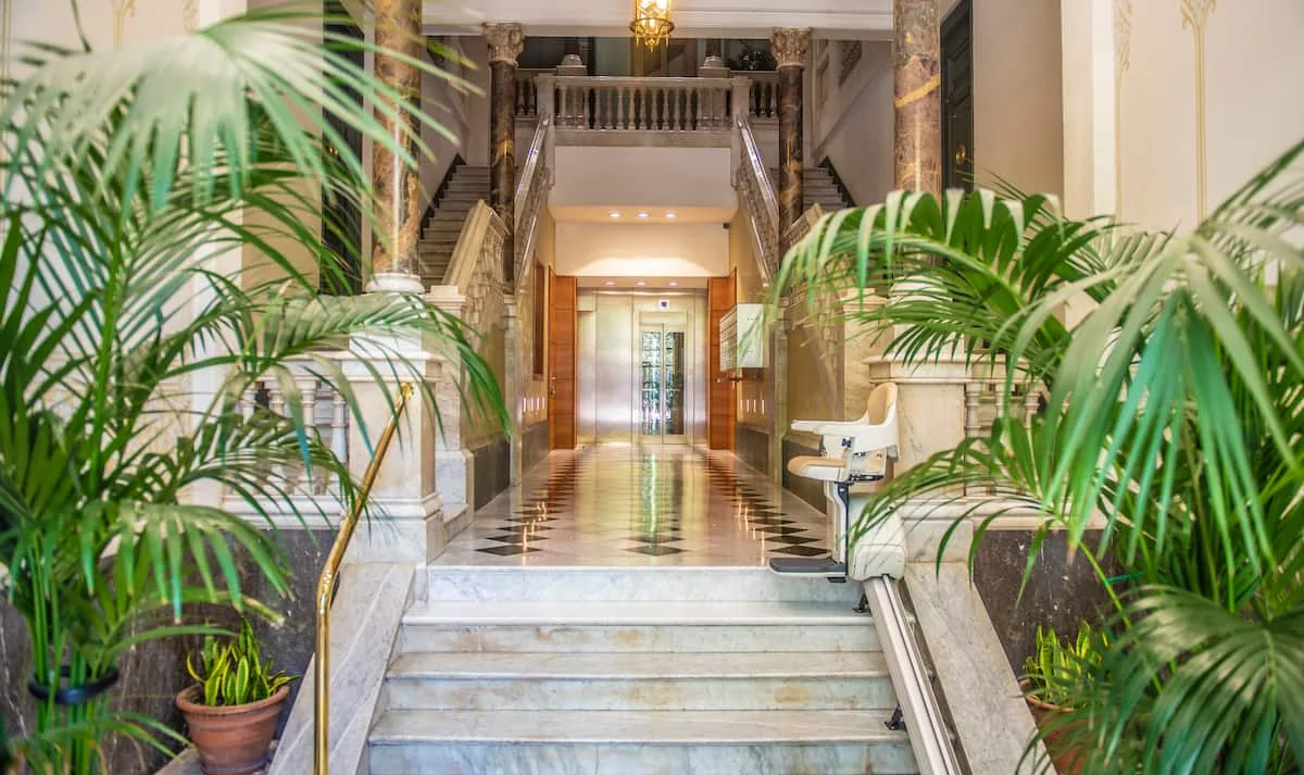 Suite Divina marble entrance hall with palms