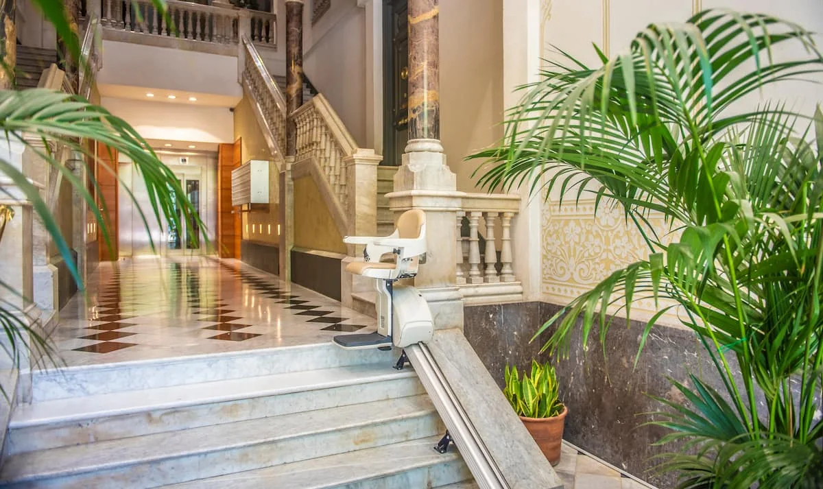 Suite Divina marble lobby and glass elevator